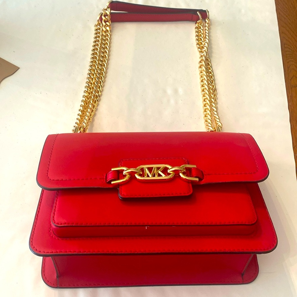 MichaelKors is red handbag with gold chain,  padded at top.  Valentine Red!